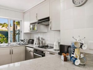 Stylish open plan lounge and dining area in KnysnaQuays 4 luxury holiday apartment