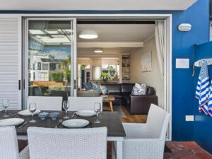 Stylish open plan lounge and dining area in KnysnaQuays 4 luxury holiday apartment