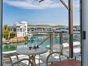 Stylish open plan lounge and dining area in KnysnaQuays 4 luxury holiday apartment